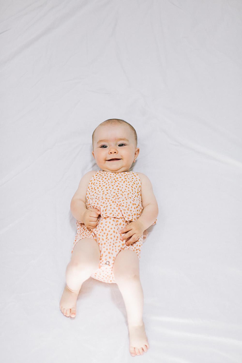 PASTEL PINK DOT PRINTED RUFFLED BODYSUIT