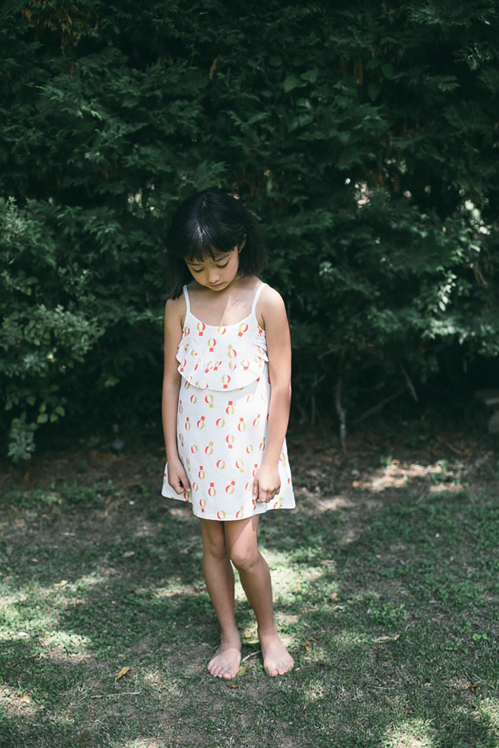 WHITE RUFFLED DRESS WITH COLORFUL BALLOON PRINT